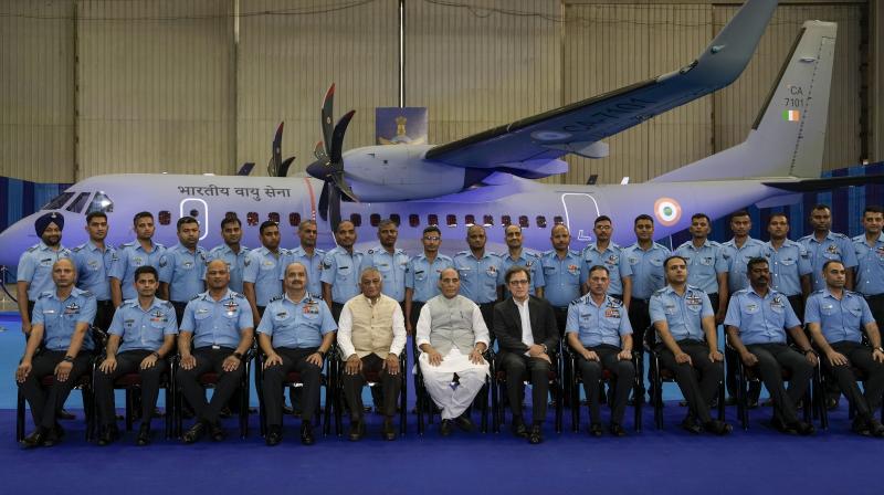 Hindon: Union Defence Minister Rajnath Singh with MoS VK Singh, IAF chief Air Chief Marshal V R Chaudhari and other IAF officers in a group photograph during formal induction of C-295 MW transport aircraft into Indian Air Force at the Hindon Air Force Station, Monday, Sept. 25, 2023. (PTI Photo/Vijay Verma)