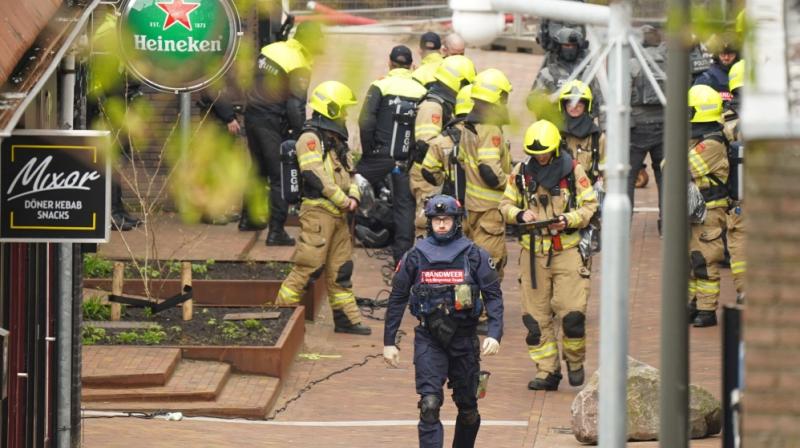 Police and emergency services gather as several people have been taken hostage in Ede.