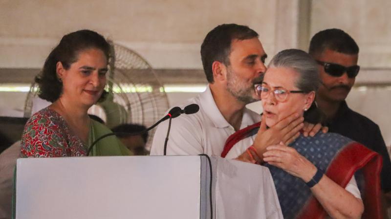 Rae Bareli: Congress leader and party candidate from Rae Bareli constituency Rahul Gandhi greets his mother and party leader Sonia Gandhi during a public meeting for the Lok Sabha elections, in Rae Bareli district, Friday, May 17, 2024. Congress leader Priyanka Gandhi is also seen. (PTI Photo)