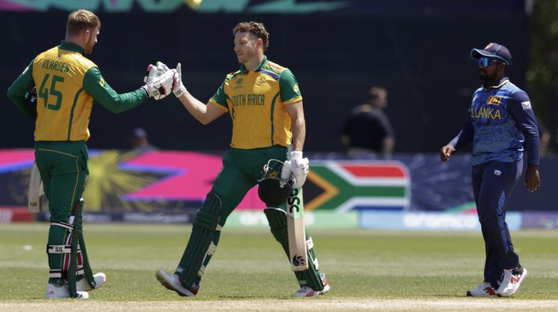 South Africa's Heinrich Klaasen, left, and batting partner David Miller celebrate after their win in the ICC Men's T20 World Cup cricket match between South Africa and Sri Lanka at the Nassau County International Cricket Stadium in Westbury, New York. (AP/PTI)