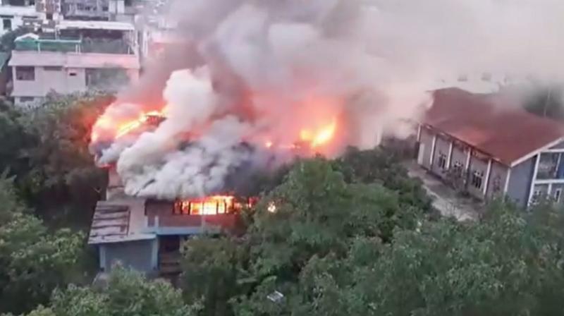 Imphal: Smoke billows after a fire broke out at an abandoned building near Manipur Chief Minister N. Biren Singh's official bungalow, in Imphal, Saturday, June 15, 2024. (PTI Photo)