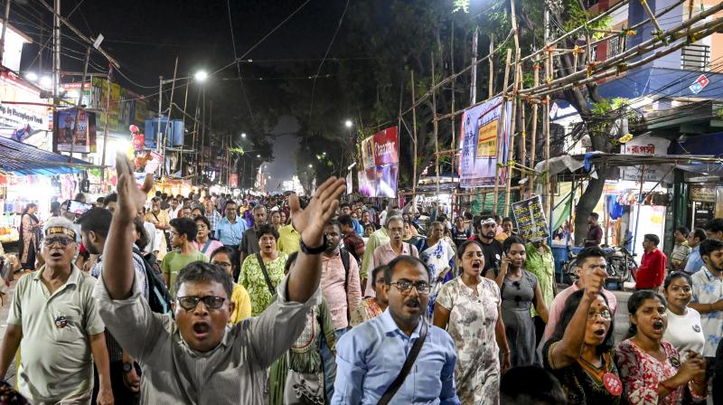 Kolkata: Junior doctors and others take part in a protest march over the alleged sexual assault and murder of a trainee doctor, in Kolkata, Saturday, Oct. 19, 2024. (PTI Photo)