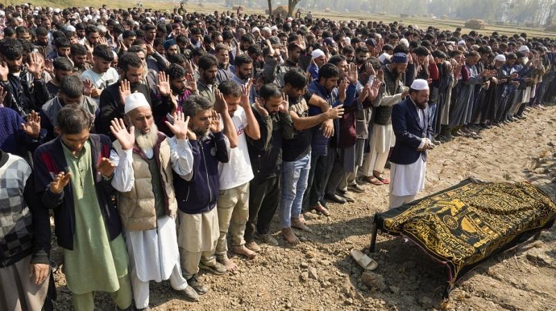 Budgam: Relatives and locals offer prayers during the funeral of doctor Shahnawaz, who was killed in a terrorist attack in J&K's Ganderbal on Sunday, at Naidgam in Budgam district, Jammu & Kashmir, Monday, Oct. 21, 2024. (PTI Photo/S Irfan)