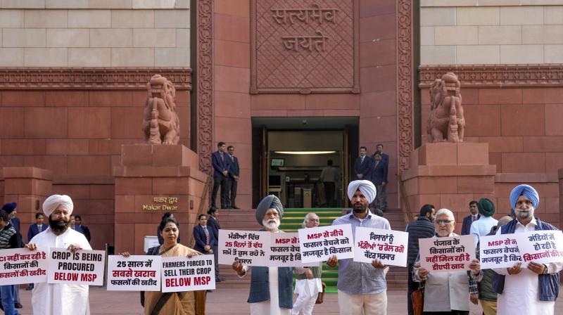 New Delhi: Congress MPs Amrinder Singh Raja Warring, Amar Singh, Sukhjinder Singh Randhawa, Dharamvira Gandhi and others protest during the ongoing Winter session of Parliament, in New Delhi, Friday, Nov. 29, 2024. (PTI Photo/Ravi Choudhary)