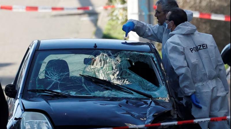 Police work at the site after a car drove into a crowd, in Mannheim, Germany.