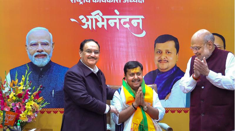 Union Ministers Amit Shah and JP Nadda congratulate newly appointed BJP National Working President Nitin Nabin during a ceremony, in New Delhi. (@AmitShah/X via PTI Photo)