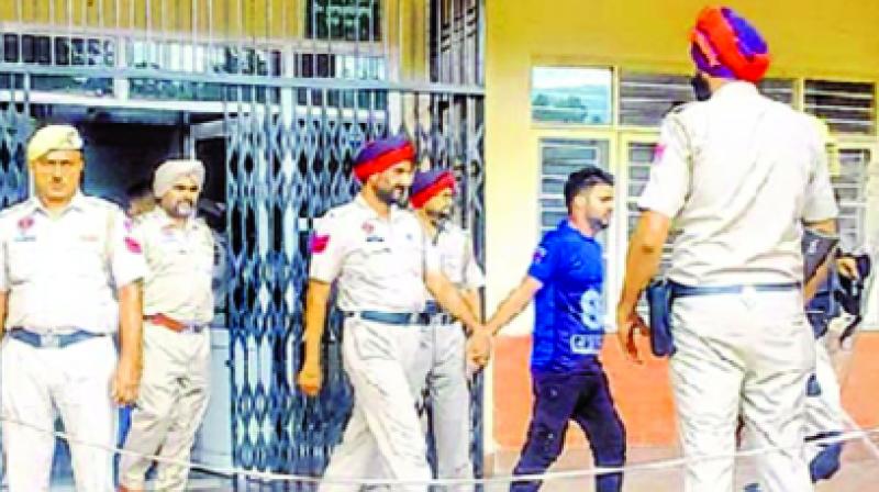 Police Officers Moving accused in the court for hearing