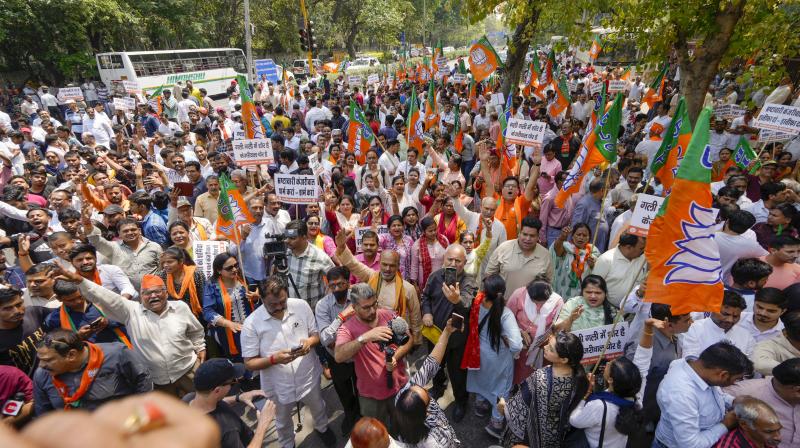 BJP workers stage a protest against Arvind Kejriwal
