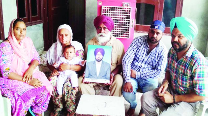 Gurjeet Singh Sarawan's family members interacting with journalists.