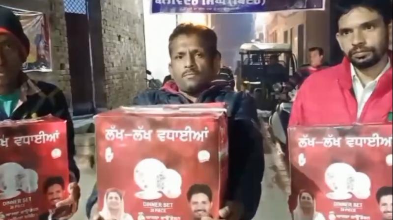 Congress candidate distributed dinner sets to voters