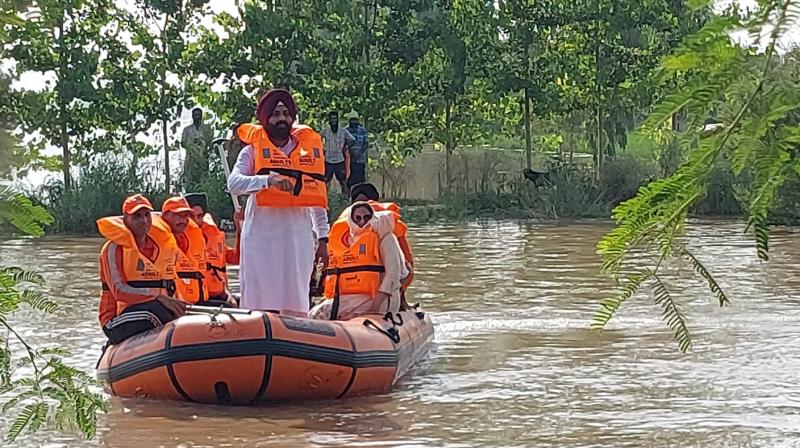  Cabinet Minister Laljit Singh Bhullar leads flood rescue operation carried out with support of NDRF in Patti
