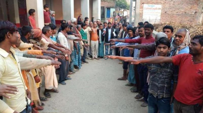 Villagers taking oath against death feast