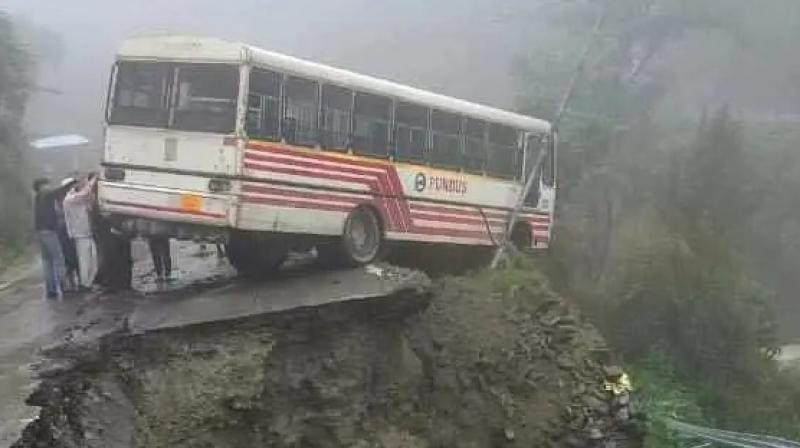 bus hanging on the side of the road on Pathankot Dalhousie Road