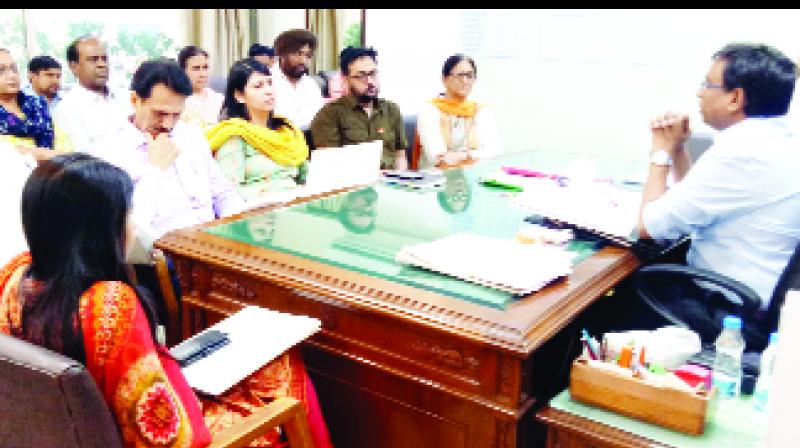 Deputy Commissioner during meeting