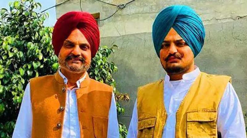 Balkaur Singh with lt. Sidhu moosewala (file photo)