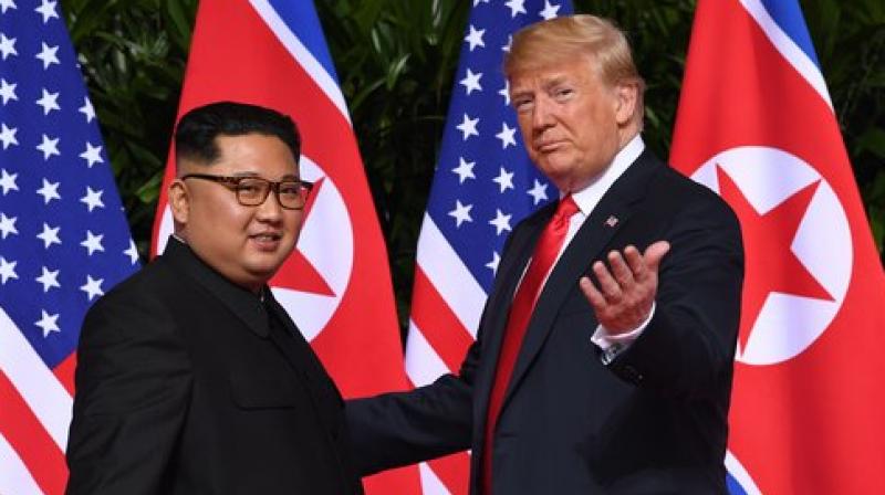 Kim Yong Un with Donald Trump