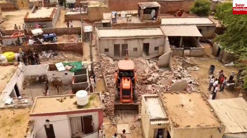 Two illegal buildings built by drug smugglers in Dhobiana Basti were demolished