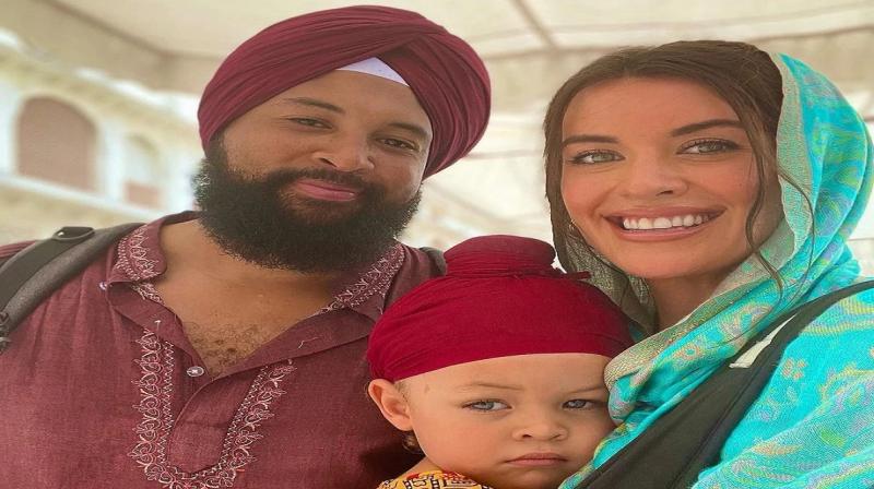 African father and son tie a turban