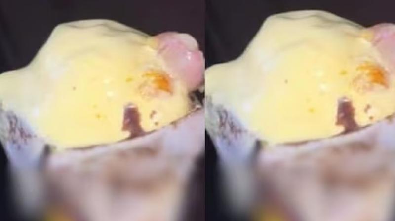 Severed finger sticking out of ice cream cone, person's senses blown