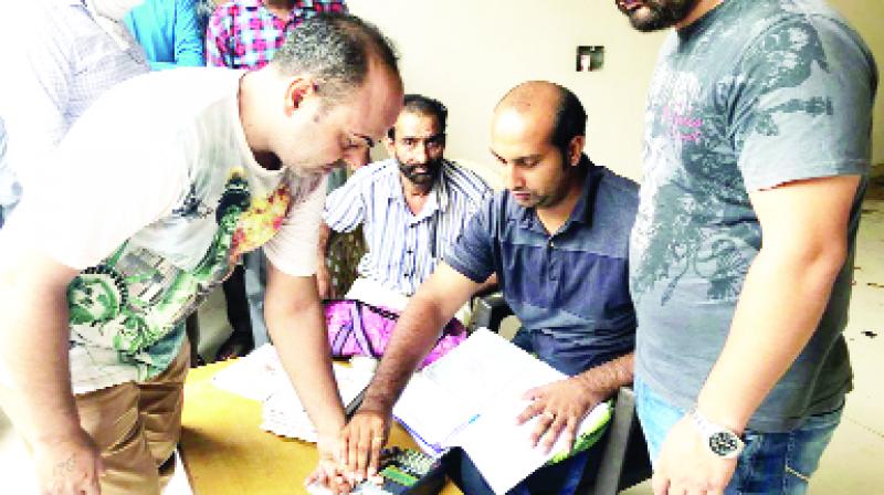 Wheat being distributed to smart card holders by e-pos machine
