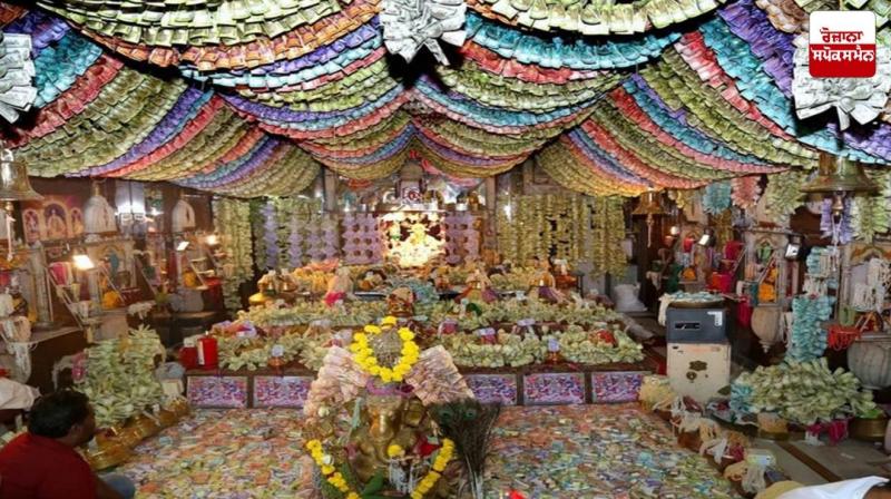 Mahalaxmi temple decorated with crores of rupees notes