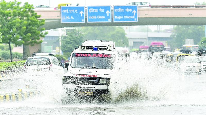 An ambulance passed through the standing water due to the Rain in Delhi