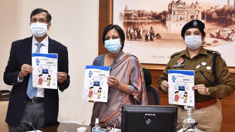 Punjab Chief Secretary Vini Mahajan releasing a booklet on cyber security at Chandigarh in the presence of DGP Dinkar Gupta during online launch of state level ‘Cyber Surakhya’ campaign in Punjab at Chandigarh on Friday November 20, 2020.