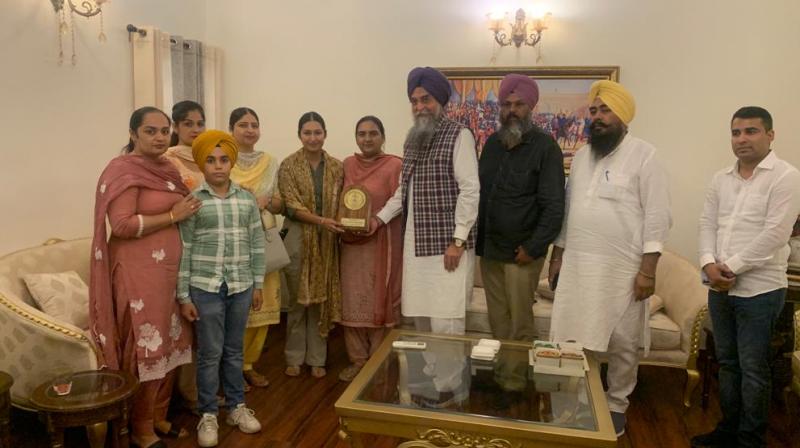 PVS Speaker Kultar Singh Sandhwan and his wife honour flying Officer Ivraj Kaur upon her arrival in Punjab
