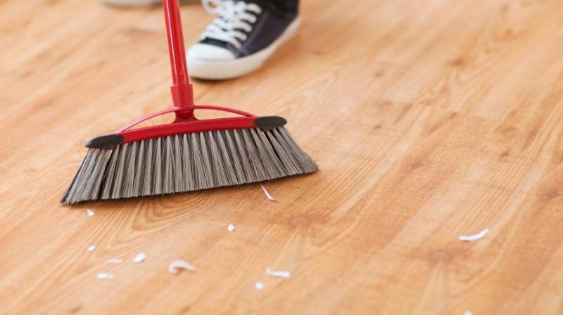 Girl sweeping floor of hospital