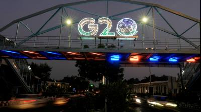 New Delhi: Vehicles move past an illuminated logo of G20 ahead of the summit, in New Delhi, Friday, Aug. 25, 2023. (PTI Photo/Manvender Vashist Lav)