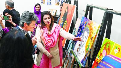 Lahore: Visitors at an exhibition at the residence of Hungarian-Indian painter Amrita Sher-Gil, on the Mall Road, in Lahore, Pakistan. (PTI Photo)