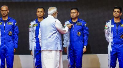 Thiruvananthapuram: Prime Minister Narendra Modi hands-over wings to astronauts-designate Shubanshu Shukla, Prashanth Balakrishnan Nair, Angad Prathap and Ajit Krishnan who have been selected to be the astronauts on India’s first crewed mission to space 'Gaganyaan Mission', at the Vikram Sarabhai Space Centre (VSSC), in Thiruvananthapuram, Tuesday, Feb. 27, 2024. (PTI Photo)