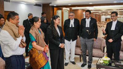 New Delhi: Pragya, who got a scholarship to study masters in law in two different universities in the US, with parents during her felicitation by the Supreme Court judges, at the Supreme Court of India in New Delhi, Wednesday, March 13, 2024. Pragya's father Ajay Kumar Samal works as a cook in Supreme Court. (PTI Photo/Shahbaz Khan)