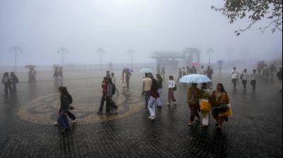 Shimla: People take a walk on a misty afternoon during rain, in Shimla, Himachal Pradesh, Saturday, Sept. 13, 2025. (PTI Photo)