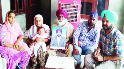 Gurjeet Singh Sarawan's family members interacting with journalists.