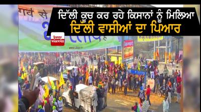 Locals in delhi shower flower petals on farmers 