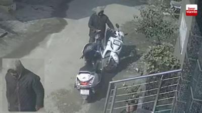 A thief was caught stealing an Activa parked outside a house under suspicious circumstances by locals