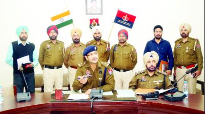 SSP Sangrur and other police officers while giving information about the captured person