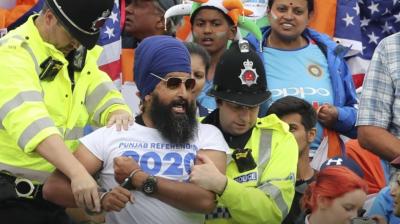 India and new zealand sikh spectator reacts as he is taken away by cops