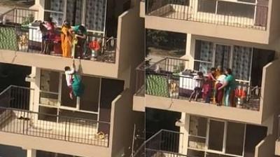 Mother hangs son from 10th floor balcony by saree