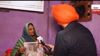 woman with PM Modi's advertisement 