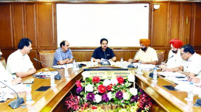 Om Prakash Soni presiding over a meeting of officials