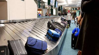 Woman boards luggage belt assuming it will take her to plane