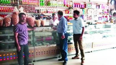 Food Safety Officers During checking Sweet Shop