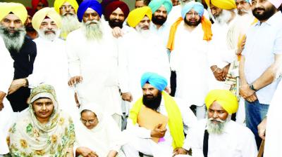 Capt Amarinder Singh and others with Victim Families