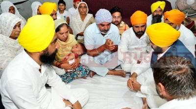 CM hands over cheque for Rs 1 crore to martyr's family