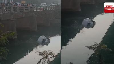 Travel vehicle hits car, car falls into canal