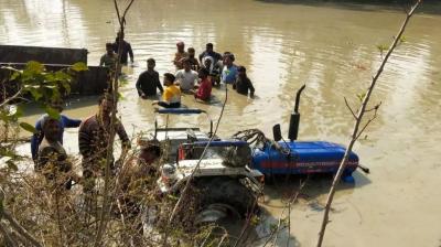 Tractor Plunges into Pond 