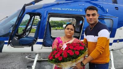 Son fulfills his mothers dream of sitting in helicopter on her 50th birthday