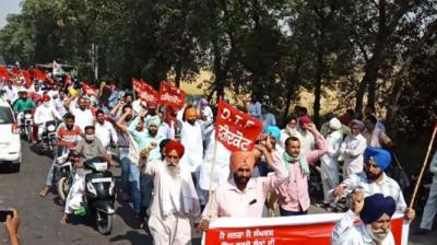 teacher with farmer protest